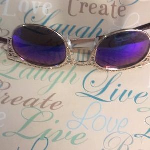 Gold Sunglasses with details around the frame.